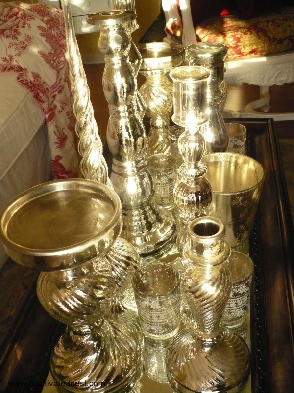 A collection of mercury glass candlesticks and holders on a  tray | Christmas decor