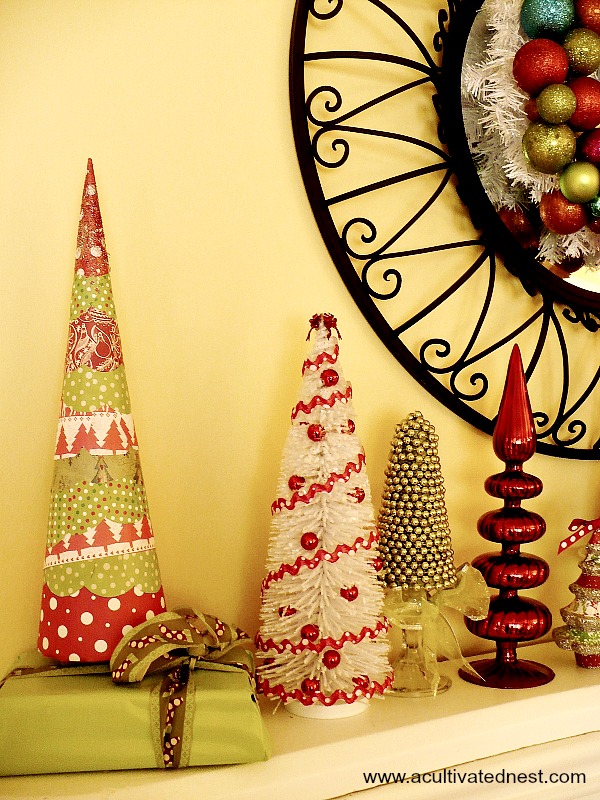 Mod Podge scrapbook paper and Styrofoam cone makes a fun Christmas decoration for this colorful mantel 