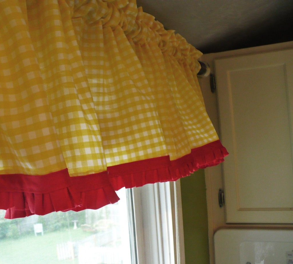 Yellow gingham curtains with red trim