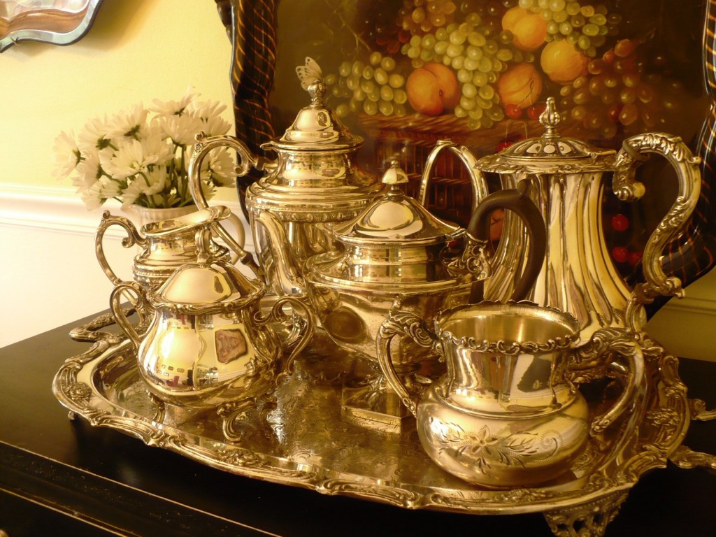 silver serving tray with silver teapots