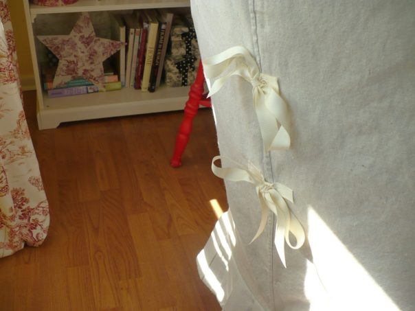 ribbon closure on slip covered chair