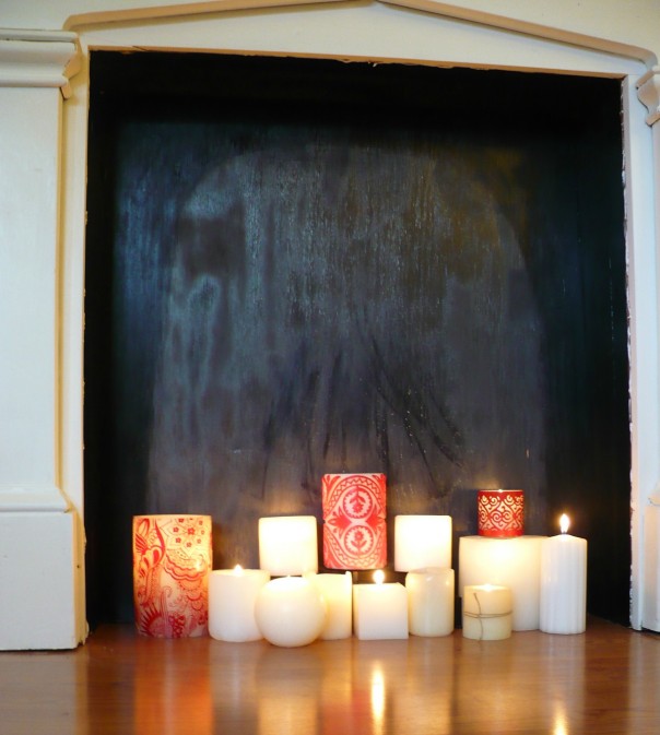 candles in a faux fireplace