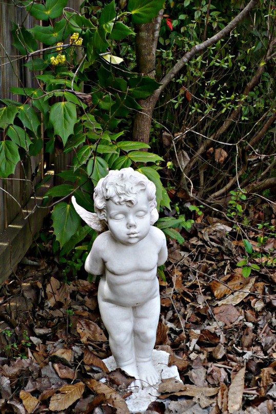 cherub statue in garden