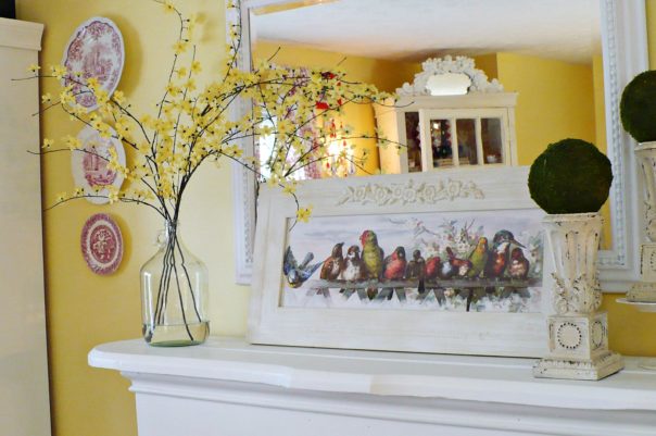 fireplace mantel decorated with spring blooming branches