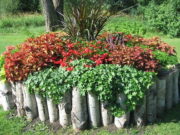 log lined flower bed