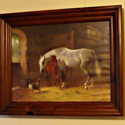 print of horses in a wooded frame