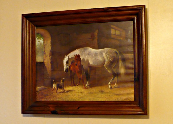 print of horses in a wooded frame