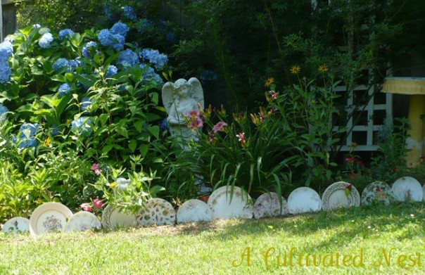 edging a garden bed with plates