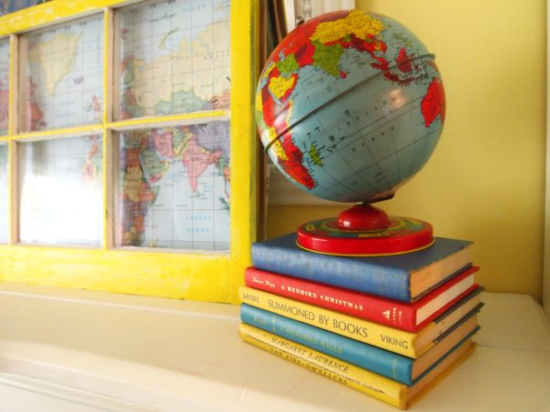 back to school mantel - vintage globe on top of books