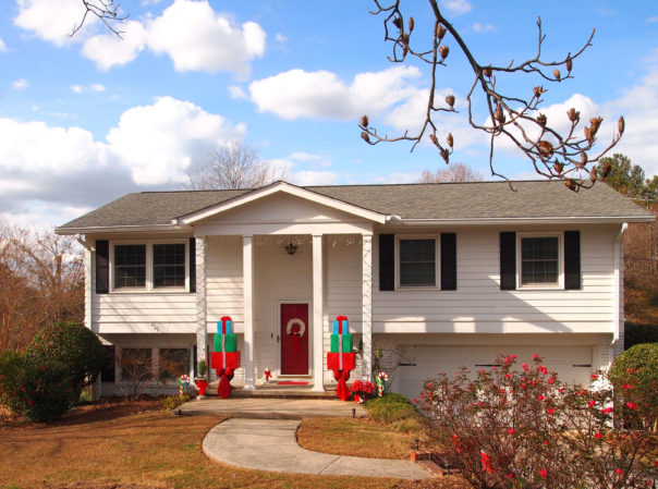 house with giftbox topiaries