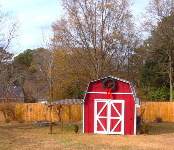 wreath on red barn