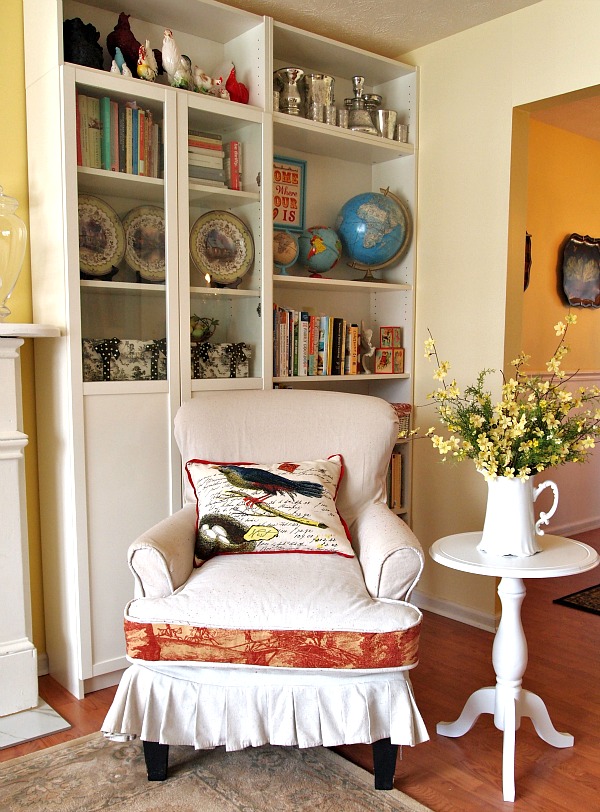 DIY slipcovered chair next to white pedestal table