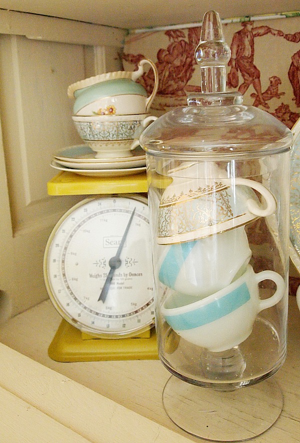 tea cups in an apothecary jar