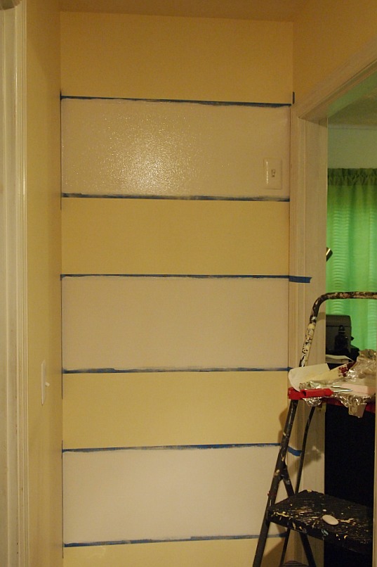 painting stripes on a wall