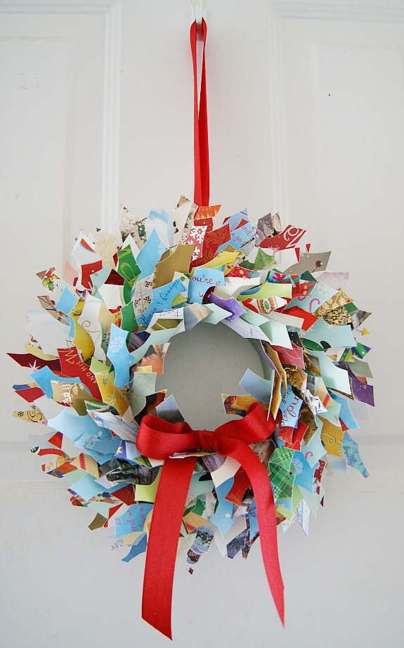 How to Reuse & Upcycle Old Christmas Cards. Awesome ideas! Here's a few Christmas cards repurposed into home decor like wreaths and wall art, gift bags and even bookmarks! #christmascrafts #upcycle #repurpose #christmascards