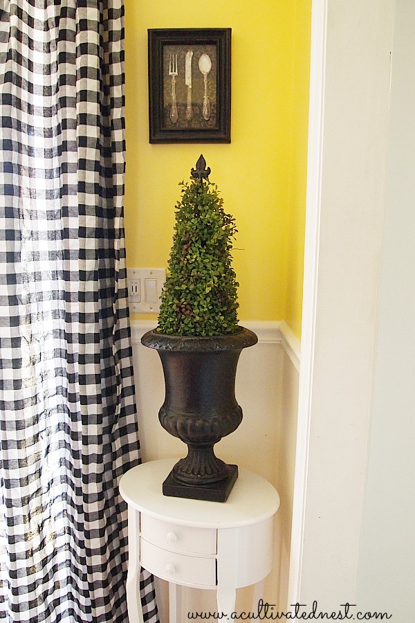 black urn with faux topiary