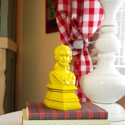 yellow bust of woman bookend