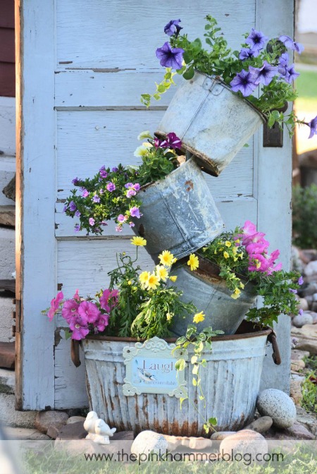 15 Amazing Flower Tower and Tipsy Pot Planters You Can Build- These DIY flower towers and tipsy pot planters are stunning ways to add vertical interest to your garden, porch, or front entry! | #tipsyPot #flowerTower #DIY #gardening #ACultivatedNest