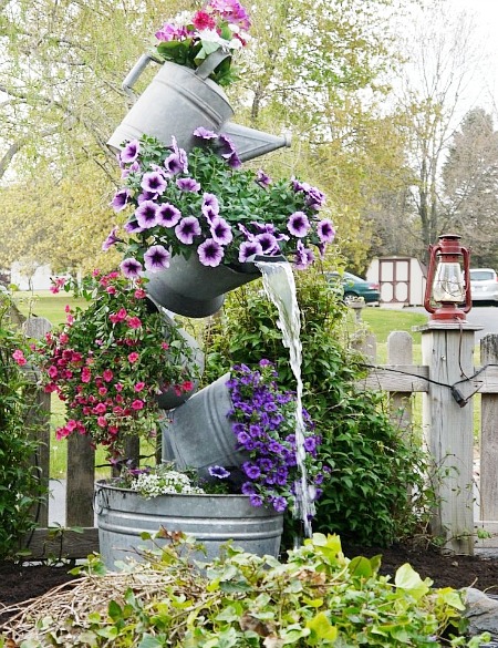 15 Amazing Flower Towers or Tipsy Pot Planters Ideas- These DIY flower towers and tipsy pot planters are stunning ways to add vertical interest to your garden, porch, or front entry! | #tipsyPot #flowerTower #DIY #gardening #ACultivatedNest