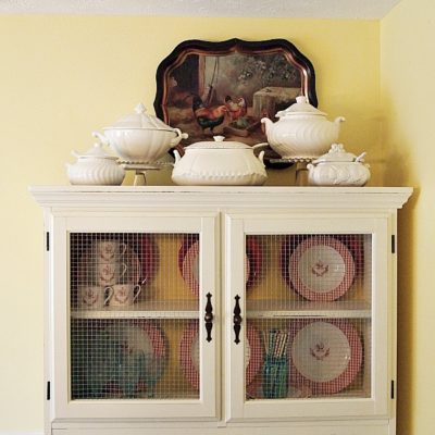 Dining room hutch makeover - soup tureen collection on top of hutch