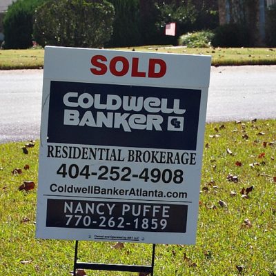 real estate sign that says sold