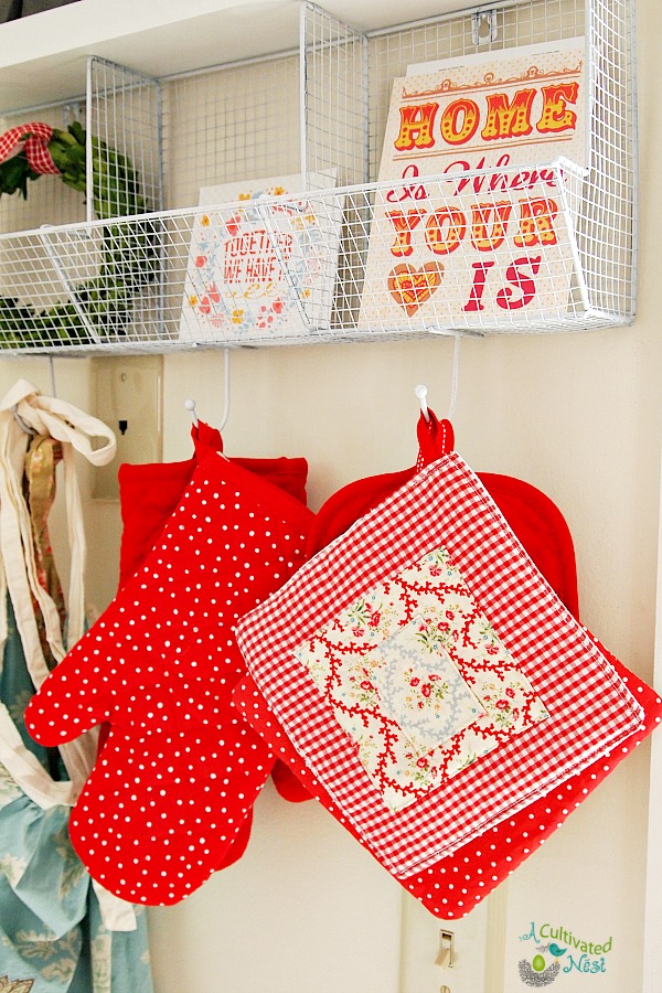 Cute kitchen shelf with hooks for pot holders and aprons