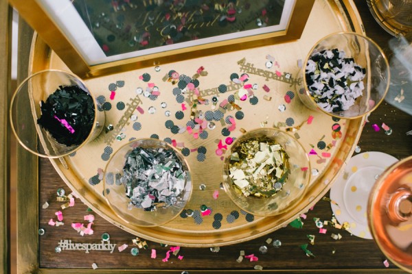 7 Festive and Frugal Ways to Decorate for New Year's Eve - use confetti on tables for New Year's Eve