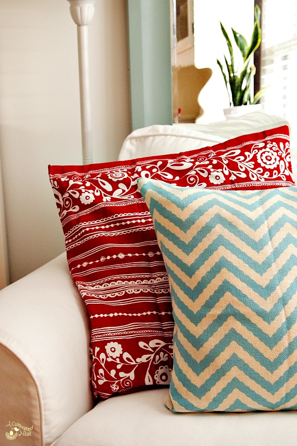 Cute color combination! Red and soft aqua pillows on a white Ektorp Chair