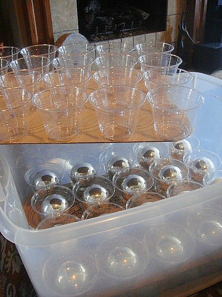 Christmas ornament storage--hot glue plastic cups to sheets of