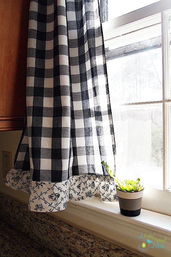 Frugal decorating - black buffalo check curtains with cute toile ruffles on the bottom thrifted from Goodwill