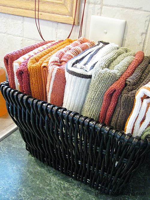 https://acultivatednest.com/wp-content/uploads/2015/01/organize-dish-towels-with-baskets.jpg