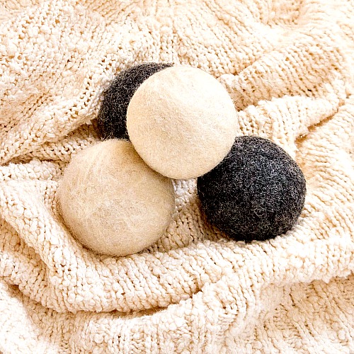 DIY Wool Dryer Balls- You can save money and help the environment at the same time by making these DIY reusable products! They're so easy to make, and you can use your favorite colors! | eco friendly, frugal, ways to save money, wool dryer balls, cloth paper towels, unpaper towels, #diy #saveMoney #ACultivatedNest