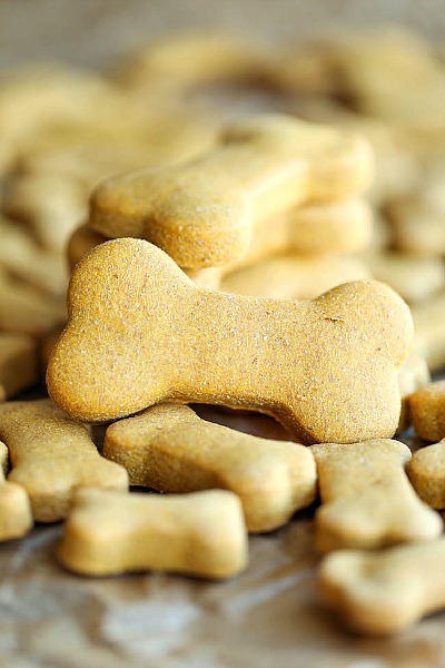 18 Easy Dog Treat Recipes to Make at Home- An easy way to save money on your pet expenses and ensure your dog eats healthy is by making these easy homemade dog treat recipes! | #dogTreats #homemadeDogTreats #dogTreatRecipes #pets #ACultivatedNest