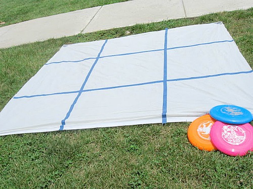 Frisbee Tic-Tac-Toe- Here are 10 inexpensive summer outdoor activities that will keep the kids or grandkids occupied all summer long! Definitely give these a try this summer! | #kidsActivities #frugalLiving #summerActivities #summerKidsActivities #ACultivatedNest