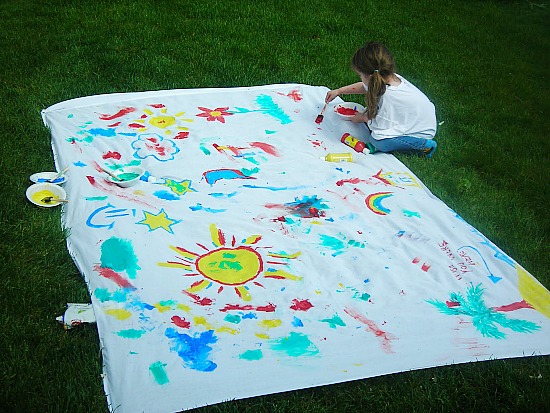 Outdoor Painting Project- Here are 10 inexpensive summer outdoor activities that will keep the kids or grandkids occupied all summer long! Definitely give these a try this summer! | #kidsActivities #frugalLiving #summerActivities #summerKidsActivities #ACultivatedNest