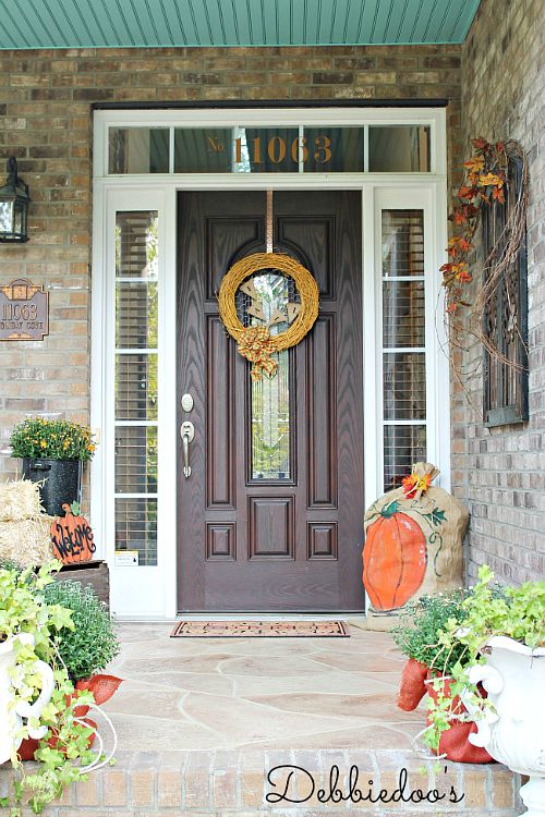 Art Pumpkins Fall Front Porch- Unsure how to decorate your front porch for autumn? Take a look at these 15 fabulous fall front porch ideas and be inspired! | #fall #porchDecor #decorating #fallDecor #ACultivatedNest