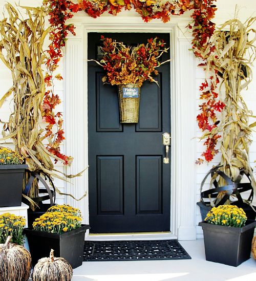 Farmhouse Door Fall Front Porch- Unsure how to decorate your front porch for autumn? Take a look at these 15 fabulous fall front porch ideas and be inspired! | #fall #porchDecor #decorating #fallDecor #ACultivatedNest