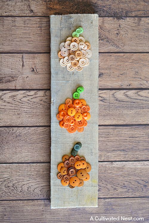 Easy Fall Pumpkin Button Craft- It can be easy to make cute DIY fall decor for your home! If you're looking for a cute fall decor project, you have to try this easy ombre pumpkin button craft! | #DIY #craft #fall #pumpkins #decor #buttons #buttonCraft #wallArt #autumn #ACultivatedNest
