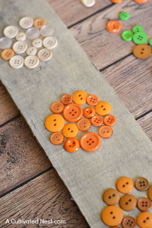 DIY Pumpkin Button Wall Art- It can be easy to make cute DIY fall decor for your home! If you're looking for a cute fall decor project, you have to try this easy ombre pumpkin button craft! | #DIY #craft #fall #pumpkins #decor #buttons #buttonCraft #wallArt #autumn #ACultivatedNest