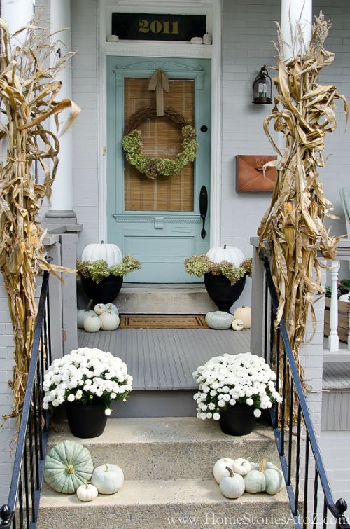 White and Blue Fall Front Porch- Unsure how to decorate your front porch for autumn? Take a look at these 15 fabulous fall front porch ideas and be inspired! | #fall #porchDecor #decorating #fallDecor #ACultivatedNest