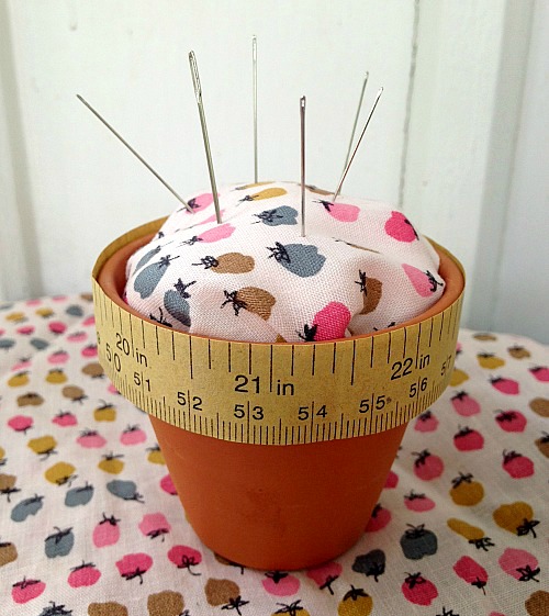 Want a stylish yet organized sewing area? Keep your pins and needles organized with this cute flower pot pin cushion craft!