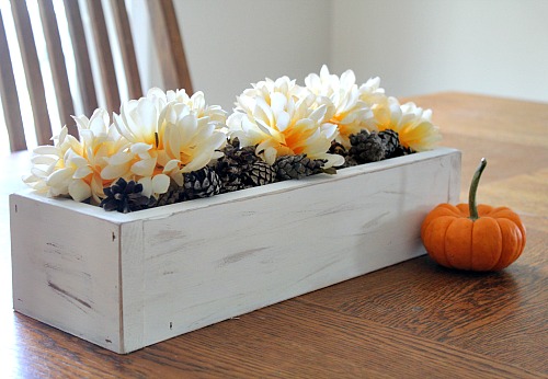 You don't need any fancy paint or special skills to make this DIY rustic planter box! This makes a great table centerpiece or piece of mantel decor!