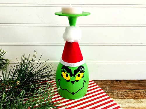 This DIY Grinch wine glass candle holder is a fun, easy and frugal holiday craft! It would also make a great holiday kids activity!