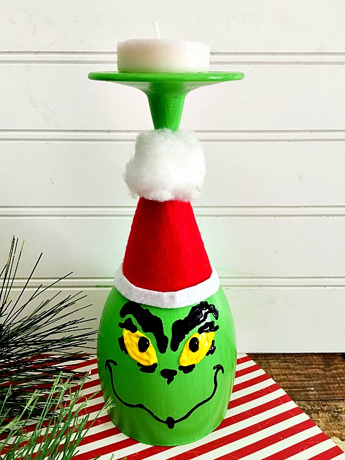 This DIY Grinch wine glass candle holder is a fun, easy and frugal holiday craft! It would also make a great holiday kids activity!