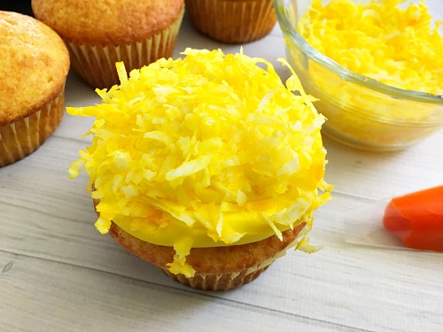 Cute Spring Chick Cupcakes- Use your favorite boxed cake mix to quickly create cupcakes that you can decorate and turn into cute spring chick cupcakes! These make a great Easter dessert! | easy recipe, Easter treat, spring food, adorable, silly, funny, baking, box mix recipe, animal themed cupcakes, yellow, orange