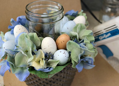 DIY Spring Mason Jar Candle Arrangement- Make this pretty DIY spring Mason jar candle arrangement for your table or another featured spot in your home to easily update your decor! | DIY project, craft, spring decor, bird, eggs, Easter, blue, centerpiece