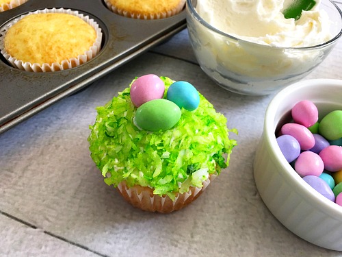 Nest Easter Cupcakes- If you want a quick, simple, but beautiful dessert to serve this Easter, you need to make these adorable nest Easter cupcakes! | easy recipe, quick recipe, boxed mix baking, Easter dessert, spring treat, eggs, grass, cupcake decorating ideas
