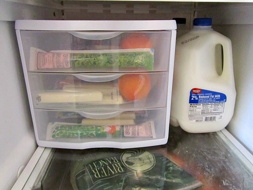 Fridge Organization Ideas- Tired of your disorganized fridge? Then you'll love these clever fridge organizing ideas! They'll help get you organized, and gain fridge space! | #organization #homeOrganization #kitchenOrganizing #fridgeOrganization #ACultivatedNest