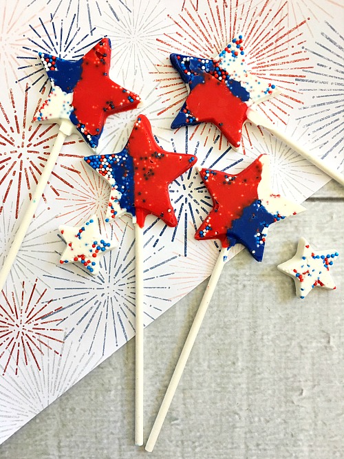 Chocolate Star Pops Dessert- These red, white, and blue chocolate star pops are a colorful, fun, and easy to make dessert treat that's perfect for Memorial Day or the Fourth of July! | patriotic dessert recipe, chocolate dessert, #recipe #dessert #MemorialDay #FourthOfJuly #ACultivatedNest
