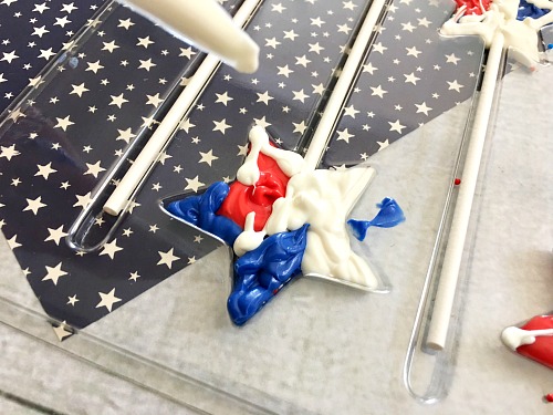 Chocolate Star Pops Dessert Treat- These red, white, and blue chocolate star pops are a colorful, fun, and easy to make dessert treat that's perfect for Memorial Day or the Fourth of July! | patriotic dessert recipe, chocolate dessert, #recipe #dessert #MemorialDay #FourthOfJuly #ACultivatedNest